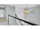 Bright foyer with a grand staircase, decorative chandelier, and a transom window at 2524 Deer Walk Way, Mount Pleasant, SC 29466