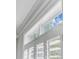 Close-up of a window with white trim, plantation shutters, and a view of the sky at 2524 Deer Walk Way, Mount Pleasant, SC 29466