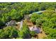 Aerial view of property showcasing the lush surroundings and access to a community pond at 2828 Olivia Marie Ln, Johns Island, SC 29455
