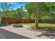 This backyard features a stone fire pit and a fenced-in yard for privacy and outdoor gatherings at 2828 Olivia Marie Ln, Johns Island, SC 29455