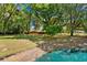 Expansive yard featuring mature trees and access to the community pond, perfect for outdoor enjoyment at 2828 Olivia Marie Ln, Johns Island, SC 29455