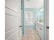 Bright bathroom with modern vanity, mirror, window and tile floor at 2828 Olivia Marie Ln, Johns Island, SC 29455