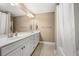 Bright bathroom with double vanity, large mirror and shower at 2828 Olivia Marie Ln, Johns Island, SC 29455