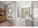 This bedroom features a canopy bed, a decorative mirror, a dresser and a window with natural light at 2828 Olivia Marie Ln, Johns Island, SC 29455