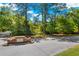 Waterloo Estates community entrance with brick sign and lush landscaping provides an inviting welcome at 2828 Olivia Marie Ln, Johns Island, SC 29455