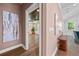 Open hallway leading to a bedroom or den with natural light, stylish decor, and hardwood floors at 2828 Olivia Marie Ln, Johns Island, SC 29455
