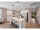 Open kitchen featuring a large island with seating, white cabinetry, and modern appliances at 2828 Olivia Marie Ln, Johns Island, SC 29455