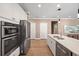 Bright kitchen features stainless steel appliances, double oven, and a spacious quartz countertop at 2828 Olivia Marie Ln, Johns Island, SC 29455