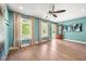 Inviting living room featuring hardwood floors, stylish decor, windows and an outdoor access door at 2828 Olivia Marie Ln, Johns Island, SC 29455
