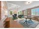 Bright living room with vaulted ceilings, fireplace, ample natural light, and hardwood floors at 2828 Olivia Marie Ln, Johns Island, SC 29455