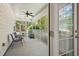 Enjoy this screened in patio with seating and ceiling fan, perfect for relaxing outdoors at 2828 Olivia Marie Ln, Johns Island, SC 29455