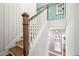 Stylish staircase with white railings and wood treads, offering a view to the floor below at 2828 Olivia Marie Ln, Johns Island, SC 29455