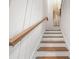 Elegant staircase with white risers and wood treads leading to the upper level at 2828 Olivia Marie Ln, Johns Island, SC 29455