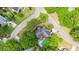 Stunning aerial view of a beautiful home with a private pool surrounded by mature trees in a lovely neighborhood at 301 Factors Walk, Summerville, SC 29485