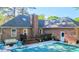Beautiful brick home features a covered pool area with wooden deck, perfect for outdoor living at 301 Factors Walk, Summerville, SC 29485
