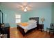Bedroom with hardwood floors, a ceiling fan and a bright window at 301 Factors Walk, Summerville, SC 29485