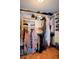 Walk-in closet with built-in shelving, hanging racks and hardwood floors at 301 Factors Walk, Summerville, SC 29485