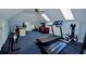 Bright, carpeted exercise room with skylights and fitness equipment at 301 Factors Walk, Summerville, SC 29485