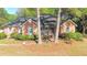 Charming brick home with a well-maintained lawn and mature landscaping at 301 Factors Walk, Summerville, SC 29485