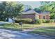Charming single-story brick home with well-manicured lawn and brick-lined walkway at 301 Factors Walk, Summerville, SC 29485