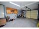 Spacious garage featuring a finished floor, built-in storage cabinets and modern fixtures, perfect for a workshop or parking at 301 Factors Walk, Summerville, SC 29485