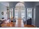 Inviting living room featuring hardwood floors, open archways, and plenty of natural light at 301 Factors Walk, Summerville, SC 29485