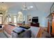 Bright living room with vaulted ceiling, skylight, hardwood floors, and a cozy fireplace at 301 Factors Walk, Summerville, SC 29485