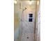 Modern shower with marble tile, glass door, and unique blue tiled inset at 301 Factors Walk, Summerville, SC 29485