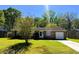Charming brick home featuring a well-maintained lawn and an attached one car garage at 3215 Bonanza Rd, Charleston, SC 29414