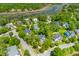 Scenic aerial view of a waterfront community with lush greenery and boat docks, offering a serene lifestyle at 3500 Maplewood Ln, Mount Pleasant, SC 29466