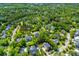 Expansive aerial view of a neighborhood featuring lush greenery and tranquil ponds, creating a serene residential setting at 3500 Maplewood Ln, Mount Pleasant, SC 29466