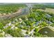 Panoramic aerial view of a residential community with waterfront access and lush greenery, showcasing a peaceful environment at 3500 Maplewood Ln, Mount Pleasant, SC 29466