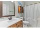 Well-lit bathroom featuring a vanity with a mirror, toilet, and a shower with a curtain at 3500 Maplewood Ln, Mount Pleasant, SC 29466