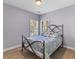 Cozy bedroom with hardwood floors and a decorative metal bedframe and cool bedding at 3500 Maplewood Ln, Mount Pleasant, SC 29466