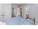 Comfortable bedroom view showing ensuite bathroom and closet entrances from the bed area at 3500 Maplewood Ln, Mount Pleasant, SC 29466