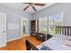 Bedroom with wood floors, bookcase, and ceiling fan at 3500 Maplewood Ln, Mount Pleasant, SC 29466
