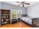 Bedroom with wood floors, a bookcase, and a ceiling fan at 3500 Maplewood Ln, Mount Pleasant, SC 29466