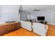 A bonus room with seating, natural light, and hardwood flooring at 3500 Maplewood Ln, Mount Pleasant, SC 29466