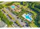 Aerial view showcasing community amenities including pools, playground, and parking areas with lush landscaping at 3500 Maplewood Ln, Mount Pleasant, SC 29466
