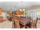 Open floor plan showing the dining area adjacent to the kitchen with a large table and many chairs at 3500 Maplewood Ln, Mount Pleasant, SC 29466
