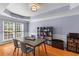 Cozy dining room with hardwood floors, a table with chairs, and a large window for natural light at 3500 Maplewood Ln, Mount Pleasant, SC 29466