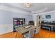 Elegant dining room featuring hardwood floors, a stylish table with chairs, and ample natural light at 3500 Maplewood Ln, Mount Pleasant, SC 29466