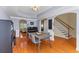 Dining room with hardwood floors, a table and chairs, and seamless access to other parts of the home at 3500 Maplewood Ln, Mount Pleasant, SC 29466
