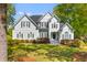 Two-story home with blue siding and black shutters, complemented by a well-manicured lawn and established landscaping at 3500 Maplewood Ln, Mount Pleasant, SC 29466
