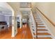 Spacious foyer with hardwood floors, a staircase, and an arched doorway leading to other living areas at 3500 Maplewood Ln, Mount Pleasant, SC 29466
