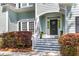 Inviting front porch with decorative door, plants, and stairs leading to the entrance of a two-story home at 3500 Maplewood Ln, Mount Pleasant, SC 29466