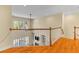 Second story hallway overlooking living room with large windows and high ceilings at 3500 Maplewood Ln, Mount Pleasant, SC 29466