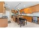 Bright, open kitchen boasts granite countertops, stainless appliances, and breakfast bar seating at 3500 Maplewood Ln, Mount Pleasant, SC 29466