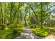 Scenic landscaped path with lush greenery, offering a tranquil walk through the neighborhood at 3500 Maplewood Ln, Mount Pleasant, SC 29466