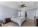 Bright main bedroom with tray ceiling, neutral walls, wood floors, and comfortable furnishings for a peaceful retreat at 3500 Maplewood Ln, Mount Pleasant, SC 29466
